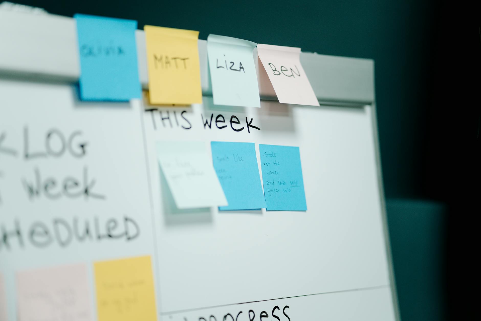 close up photo of sticky notes on whiteboard